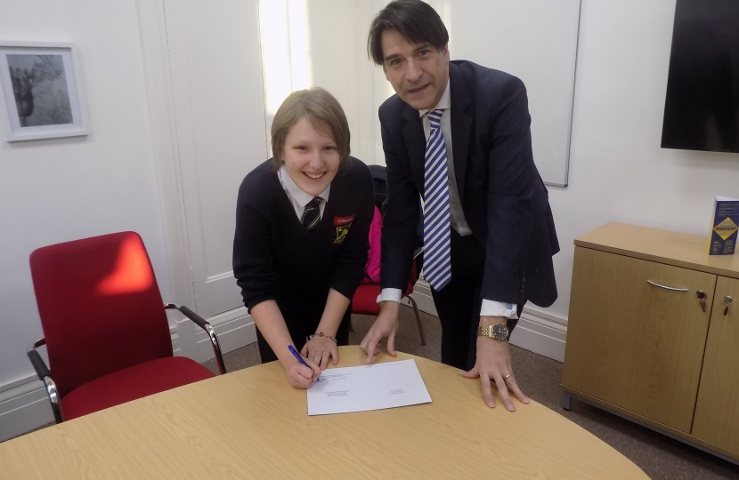 James Morris MP presents the competition winner, Abigail Palmer, with her prize